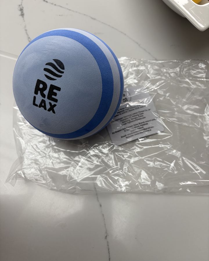 RELAX Massage Ball on a marble counter